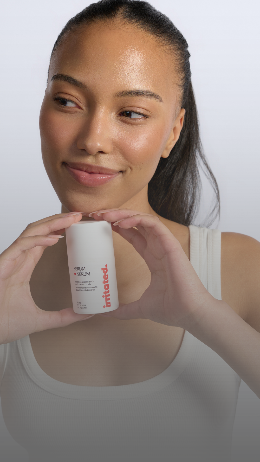 Ella MacCuish holding Irritated serum clinically proven clean fragrance free sensitive skin