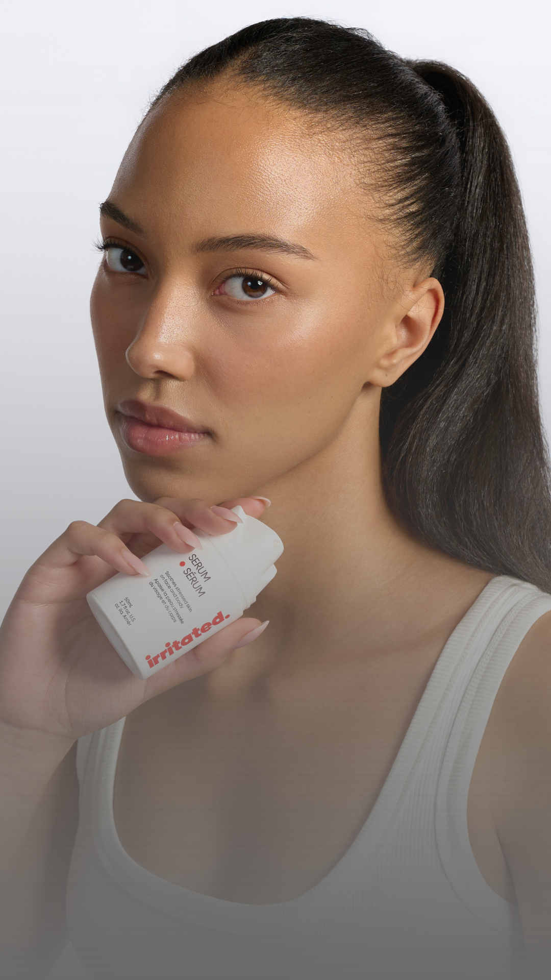 Ella MacCuish holding Irritated serum clinically tested safe for sensitive and reactive skin