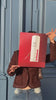 Lucy Ji holding poster of irritated 150ml face and body serum fragrance free
